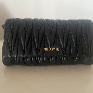 Miu Miu black matelassé leather crossbody bag with gold-tone hardware